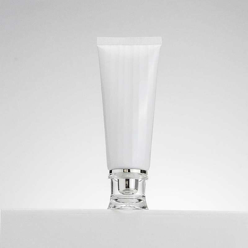 Facial cleanser tube with brush